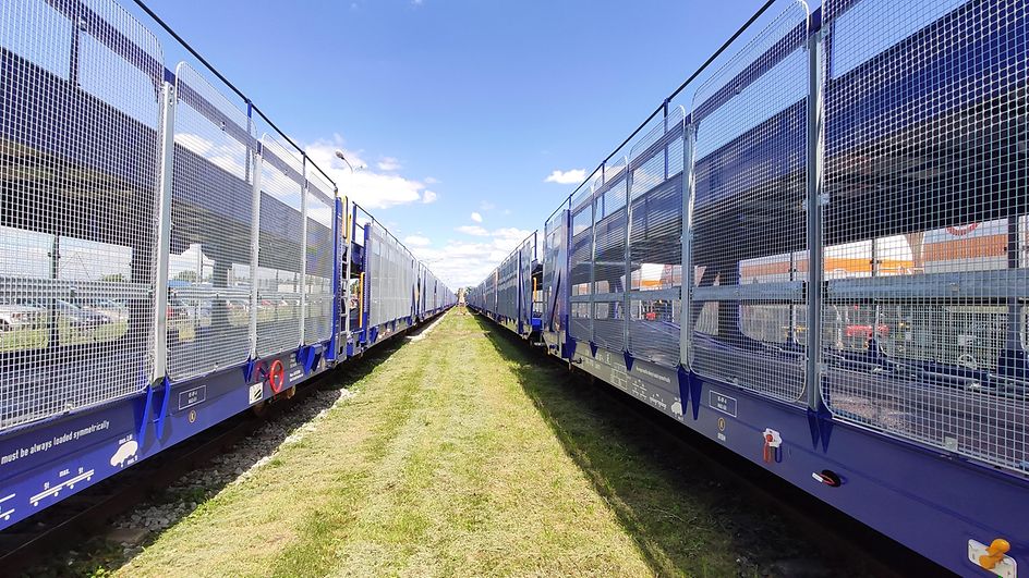 Two empty car carrier trains 