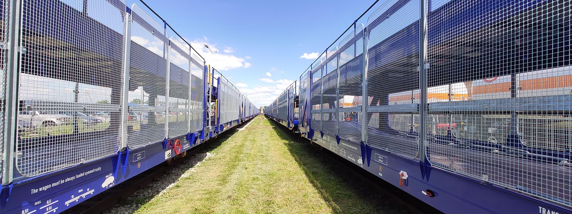 Two empty car carrier trains 