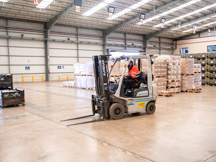 Employee driving a forklift 